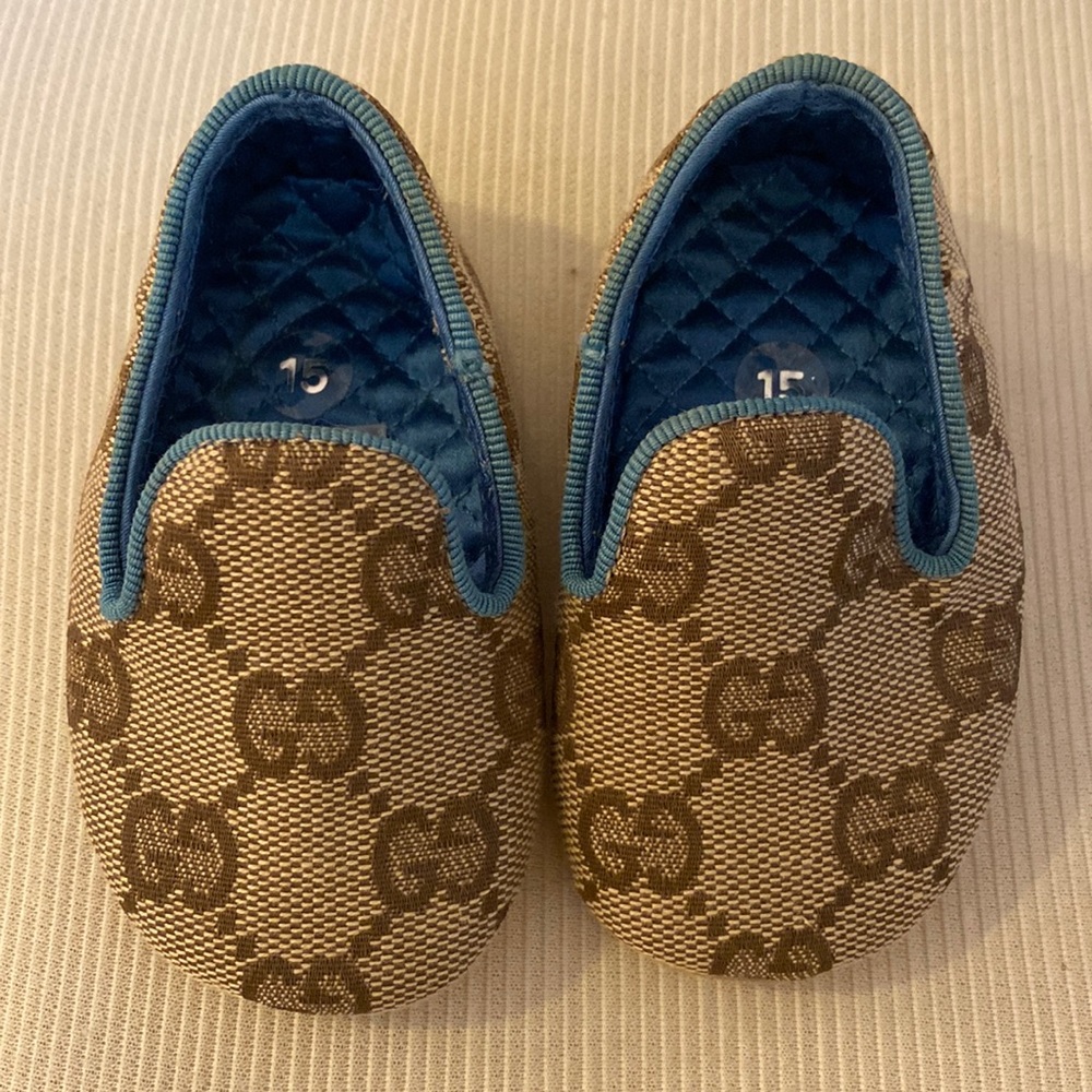 Gucci baby booties. Classic Gucci print with blue lining and piping. Like new.